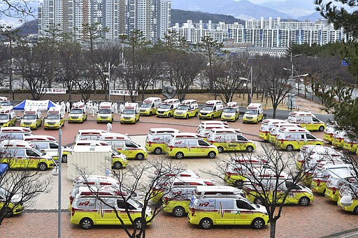 Ambulances are parked to transport patients with mild symptoms of the coronavirus in Daegu, South Korea, Tuesday, March 3, 2020. China's coronavirus caseload continued to wane Tuesday even as the epidemic took a firmer hold beyond Asia. (Lee Moo-ryul/Newsisvia AP)