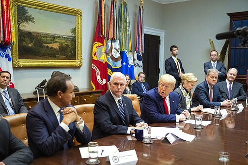 President Donald Trump with, from left, United Airlines CEO Oscar Munos, Vice President Mike Pence, Trump, White House coronavirus response coordinator Dr. Deborah Birx, American Airlines CEO Doug Parker, Southwest CEO Gary Kelly, speaks during a coronavirus briefing with Airline CEOs in at the Roosevelt Room of the White House, Wednesday, March 4, 2020, in Washington. (AP Photo/Manuel Balce Ceneta)