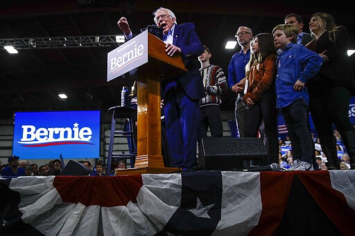 Democratic presidential candidate Sen. Bernie Sanders, I-Vt., accompanied by his wife Jane O'Meara Sanders and other family members, speaks during a primary night election rally in Essex Junction, Vt., Tuesday, March 3, 2020. (AP Photo/Matt Rourke)