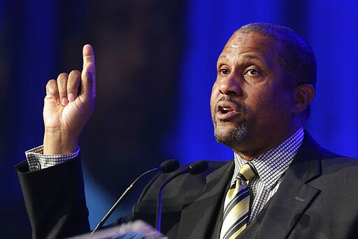 FILE - In this May 29, 2014 file photo, author and talk show host Tavis Smiley speaks at Book Expo America in New York.  A jury on Wednesday found that former talk show host Tavis Smiley violated the morals clause of his contract with the Public Broadcasting Service after allegations of workplace sexual misconduct, and must pay his former employer about $1.5 million. (AP Photo/Mark Lennihan, File)