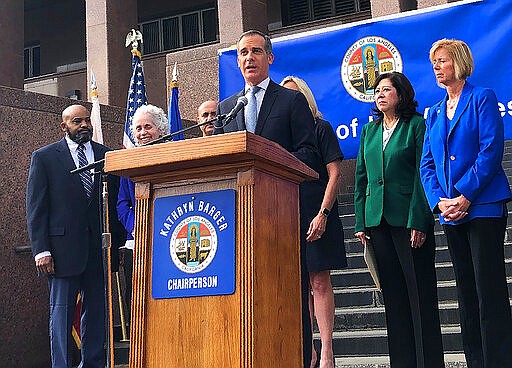 Los Angeles Mayor Eric Garcetti speaks at a news conference that announced that six new cases of the coronavirus have been confirmed in Los Angeles County, where there was one previously, on the steps of the county Hall of Administration in downtown Los Angeles Wednesday, March 4, 2020 The cases confirmed Tuesday night were due to a known exposure and not the result of so-called community transmission, Dr. Barbara Ferrer, director of the county Department of Public Health, said. One person was hospitalized and five others were in self-quarantine at home, she said. The cases were from throughout the county, she said, but did not give specific locations. (AP Photo/Stafanie Dazio)