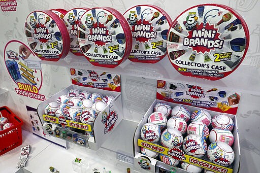 5 Surprise Mini Brands, by Zuru, are displayed at Toy Fair New York, in the Javits Convention Center, Monday, Feb. 24, 2020.   From Baby Yoda to eco-friendly stacking rings, toymakers displayed an array of goods that they hope will be on kids' wish lists for the holiday 2020 season. The four-day Toy Fair comes as the U.S. toy industry has been whipsawed by a number of obstacles.  (AP Photo/Richard Drew)