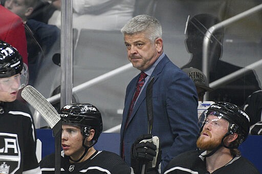 FILE - In this Jan. 29, 2020, file photo, Los Angeles Kings head coach Todd McLellan watches an NHL hockey game against the Tampa Bay Lightning, in Los Angeles. Buffalo&#146;s Ralph Krueger, Anaheim&#146;s Dallas Eakins and Los Angeles&#146; Todd McLellan had no illusions about quick fixes in their first seasons. But in a league that has seen plenty of coaching changes the past couple seasons, all three have remained consistent in their message since training camp started last September. (AP Photo/Michael Owen Baker, File)