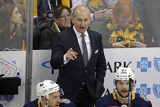 Buffalo Sabres' head coach Ralph Krueger stands behind his bench during the first period of the team's NHL hockey game against the Pittsburgh Penguins in Pittsburgh, Saturday, Feb. 22, 2020. (AP Photo/Gene J. Puskar)