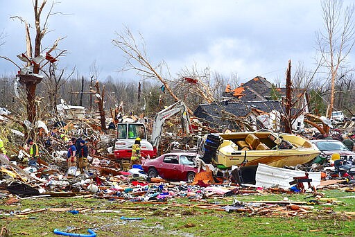 Emergency rescue personnel search for the missing in Cookville, Tenn., where several homes exploded from their foundations during the powerful storm Tuesday, March 3, 2020. (Jack McNeely/The Herald-Citizen via AP)