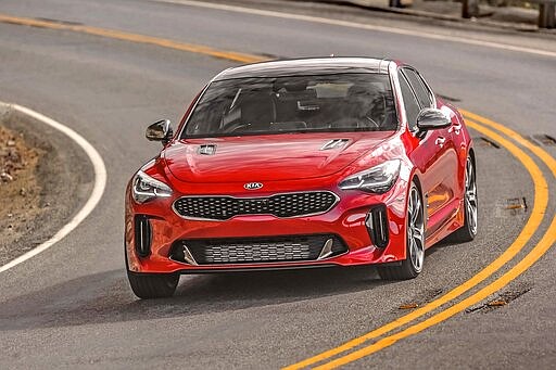 This photo provided by Kia shows the 2020 Kia Stinger, a performance-oriented midsize four-door car. The Stinger is technically a hatchback with a cargo area that can hold more gear than a typical sedan. (Courtesy of Kia Motors America via AP)