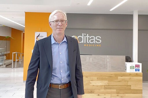 Charles Albright, executive vice president and chief scientific officer at Editas Medicine, a genome-editing company, in Cambridge, Mass., walks through the company's office on Jan. 8, 2020. &#147;We literally have the potential to take people who are essentially blind and make them see,&#148; said Albright, whose company is developing a gene editing treatment for blindness with Dublin-based Allergan. &#147;We think it could open up a whole new set of medicines to go in and change your DNA.&quot; (AP Photo/Rodrique Ngowi)