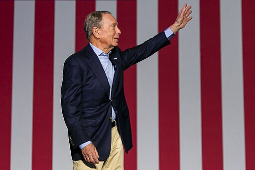 Democratic presidential candidate Mike Bloomberg waves to supporters as he arrives to his campaign rally at the Palm Beach County Convention Center in West Palm Beach, Fla., Tuesday, March 3, 2020. (Matias J. Ocner/Miami Herald via AP)