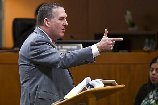 Deputy District Attorney John Lewin gestures during the second day of opening statements of Durst's murder trial at the Airport Branch Courthouse in Los Angeles during his murder trial at the Airport Branch Courthouse in Los Angeles on Thursday, March 5, 2020. After a Hollywood film about him, an HBO documentary full of seemingly damning statements, and decades of suspicion, Durst is now on trial for murder. In opening statements Thursday, prosecutors argued Durst killed his close friend Susan Berman before New York police could interview her about the 1982 disappearance of Durst's wife. (Robyn Beck/AFP via AP, Pool)