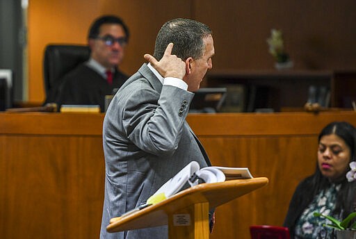 Deputy District Attorney John Lewin gestures during the second day of opening statements of Durst's murder trial at the Airport Branch Courthouse in Los Angeles during his murder trial at the Airport Branch Courthouse in Los Angeles on Thursday, March 5, 2020. After a Hollywood film about him, an HBO documentary full of seemingly damning statements, and decades of suspicion, Durst is now on trial for murder. In opening statements Thursday, prosecutors argued Durst killed his close friend Susan Berman before New York police could interview her about the 1982 disappearance of Durst's wife. (Robyn Beck/AFP via AP, Pool)