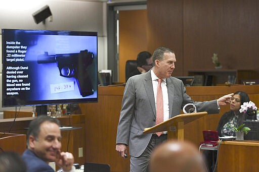 Deputy District Attorney John Lewin gestures during the second day of opening statements of Durst's murder trial at the Airport Branch Courthouse in Los Angeles during his murder trial at the Airport Branch Courthouse in Los Angeles on Thursday, March 5, 2020. After a Hollywood film about him, an HBO documentary full of seemingly damning statements, and decades of suspicion, Durst is now on trial for murder. In opening statements Thursday, prosecutors argued Durst killed his close friend Susan Berman before New York police could interview her about the 1982 disappearance of Durst's wife. (Robyn Beck/AFP via AP, Pool)