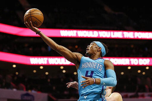 Charlotte Hornets guard Devonte' Graham drives to the basket against the Denver Nuggets during the first half of an NBA basketball game in Charlotte, N.C., Thursday, March 5, 2020. (AP Photo/Nell Redmond)