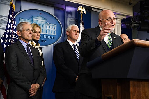 Director of the Centers for Disease Control and Prevention Robert Redfield, with, from left, Director of the National Institute of Allergy and Infectious Diseases at the National Institutes of Health Anthony Fauci, White House coronavirus response coordinator Dr. Deborah Birx and Vice President Mike Pence, speaks to reporters in the Brady press briefing room of the White House, Wednesday, March 4, 2020, in Washington. (AP Photo/Manuel Balce Ceneta)