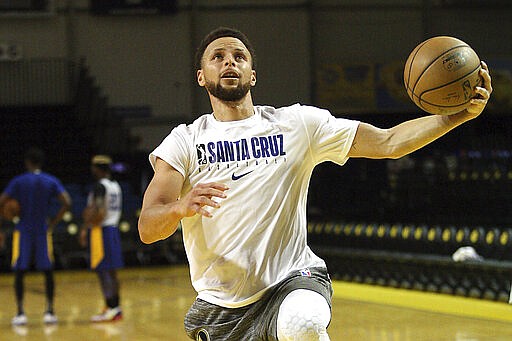 Golden State Warriors guard Stephen Curry, recovering from a fractured left hand, works out Monday, March 2, 2020, at the Santa Cruz Warriors G League facility in Santa Cruz, Calif., in preparation for his return. (Dan Coyro/Santa Cruz Sentinel via AP)