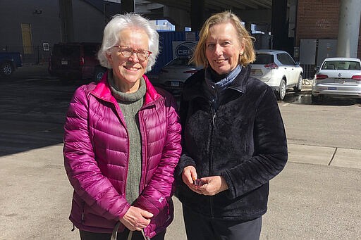 Linda Rosales, left, and Linda Dee pose for a photo after they carpooled to a campaign event with Sen. Amy Klobuchar, D-Minn., in Denver on March 2, 2020, only to find she had ended her presidential bid. The two had hoped to back a woman but are accepting the Democratic race will come down to two white men. (AP Photo/Nicholas Riccardi)