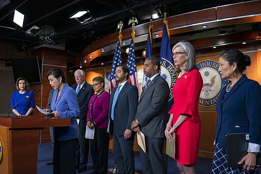 Rep. Judy Chu, D-Calif., chair of the Congressional Asian Pacific American Caucus, speaks to the media as members of the Congressional Tri-Caucus meet with reporters to discusses the 2020 Census on Capitol Hill in Washington, Thursday, March 5, 2020. From left are House Speaker Nancy Pelosi, D-Calif., Chu, House Majority Leader Steny Hoyer, D-Md., Rep. Karen Bass, D-Calif., chair of the Congressional Black Caucus, Rep. Joaquin Castro, D-Texas, chair of the Congressional Hispanic Caucus, Rep. Steven Horsford, D-Nev., 2020 Census Task Force for the CBC, Democratic Caucus Vice Chair Katherine Clark, D-Mass., and Rep. Deb Haaland, D-N.M., Native American Caucus co-chair. (AP Photo/J. Scott Applewhite)