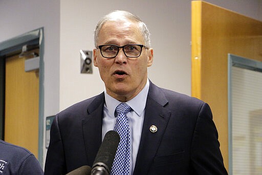 Washington Gov. Jay Inslee speaks to the press at the state Department of Health about the latest updates on coronavirus in the state, Wednesday, March 4, 2020, in Tumwater, Wash. The state has now reported 39 COVID-19 cases, all in the greater Seattle area, including 10 deaths. (AP Photo/Rachel La Corte)