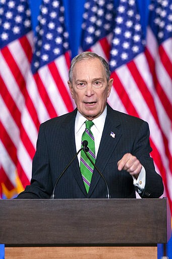 Former Democratic presidential candidate Mike Bloomberg waves to supporters as he announces the suspension of his campaign and his endorsement of former Vice President Joe Biden for president in New York Wednesday , March 4, 2020. (AP Photo/Eduardo Munoz Alvarez)