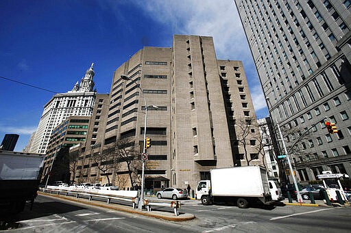 FILE- This March 12, 2009 photo shows the Metropolitan Correctional Center in New York City.  The federal jail in New York City where wealthy financier Jeffrey Epstein took his own life is on lockdown as authorities try to determine whether someone smuggled a gun inside one of the most secure federal jails in the country. That's according to two people familiar with the matter who spoke Friday to The Associated Press. (AP Photo/Mark Lennihan, File)