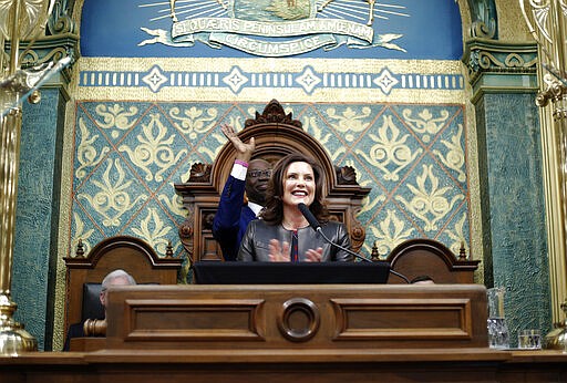 Michigan Gov. Gretchen Whitmer delivers her State of the State address to a joint session of the House and Senate, Wednesday, Jan. 29, 2020, at the state Capitol in Lansing, Mich. Behind Whitmer is Lt. Gov. Garlin Gilchrist II. (AP Photo/Al Goldis)