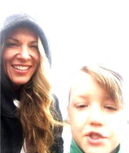 In this Sept. 8, 2019, photo released by the Federal Bureau of Investigation, is Lori Vallow and her 7-year-old son JJ Vallow in Yellowstone National Park. Lori Vallow is expected to be sent from Hawaii to Idaho to face charges in the disappearance of her young son and teenage daughter. Vallow was arrested last month in Hawaii on felony charges of child abandonment in Idaho. She's being held on $5 million bail, and her first court appearance in Idaho is Friday, March 6, 2020. (FBI via AP)