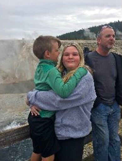 In this Sept. 8, 2019, photo released by the Federal Bureau of Investigation, is 7-year-old JJ Vallow with his sister, 17-year-old Tylee Ryan and their uncle, Alex Cox, in Yellowstone National Park. Lori Vallow is expected to be sent from Hawaii to Idaho to face charges in the disappearance of her young son and teenage daughter. Vallow was arrested in February 2020 in Hawaii on felony charges of child abandonment in Idaho. The case has attracted attention with revelations of her doomsday beliefs and a series of mysterious deaths. She's being held on $5 million bail, and her first court appearance in Idaho is Friday, March 6. (FBI via AP)