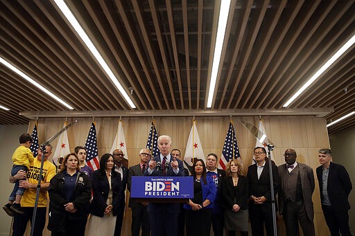 Democratic presidential candidate former Vice President Joe Biden speaks, surrounded by supporters, Wednesday, March 4, 2020, in Los Angeles. (AP Photo/Marcio Jose Sanchez)