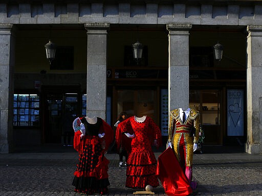 Flamenco and bullfighter costumes are displayed at Mayor Square in Madrid, Spain, Wednesday, March 4, 2020. (AP Photo/Manu Fernandez)