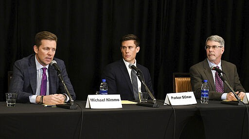 From left, Wahlberg, Woodruff, Nimmo &amp; Sloane, LLP attorneys Michael Nimmo, Parker Stinar and Dan Sloane hold a news conference regarding alleged sexual abuse claims by their clients against former University of Michigan doctor, Dr. Robert E. Anderson at the Sheraton Detroit Novi Hotel in Novi, Mich., Wednesday, March 4, 2020. (Robin Buckson/Detroit News via AP)