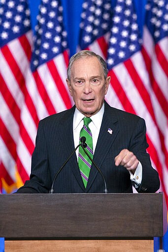 Former Democratic presidential candidate Mike Bloomberg waves to supporters as he announces the suspension of his campaign and his endorsement of former Vice President Joe Biden for president in New York Wednesday , March 4, 2020. (AP Photo/Eduardo Munoz Alvarez)