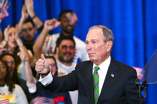 Former Democratic presidential candidate Mike Bloomberg gestures to supporters as he announces the suspension of his campaign and his endorsement of former Vice President Joe Biden for president in New York Wednesday , March 4, 2020. (AP Photo/Eduardo Munoz Alvarez)