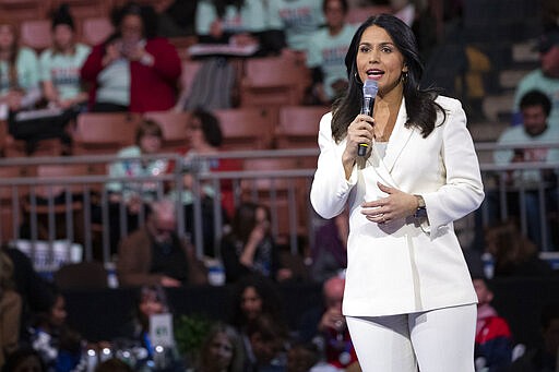 FILE - In this Feb. 8, 2020, file photo, Democratic presidential candidate Rep. Tulsi Gabbard, D-Hawaii, speaks during the McIntyre-Shaheen 100 Club Dinner in Manchester, N.H. Gabbard of Hawaii, who was born in American Samoa, received one delegate. Bloomberg&#146;s decisive win over the local-born Gabbard was startling, but the Hawaii congresswoman had a late start campaigning in the territory compared with the billionaire. (AP Photo/Mary Altaffer, File)