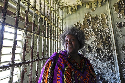 In this Feb. 29, 2020, photo, Jamida Orange looks around the Perry County Jail cell in Marion, Ala., where her father, the Rev. James Orange, a project coordinator for the Southern Christian Leadership Conference, was held in 1965 after his arrest while organizing a voter registration drive. When students began skipping school to join the marches, authorities arrested Orange on Feb. 18, 1965, for contributing to the?delinquency?of minors. (AP Photo/Julie Bennett)