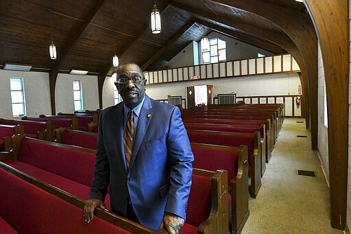 In this Feb. 16, 2020, photo, Perry County Commissioner Albert Turner Jr. poses for a photograph in the pews of the Marion Baptist Academy before Jimmie Lee Jackson day in Marion, Ala. What happened in Marion is now a little-remembered episode in the civil rights movement, a footnote in the textbooks. &quot;Starting the story in Selma is like reading a book by starting in the middle and not going back to the beginning so you can get the total picture of what?actually happened?in 1965,&quot; Turner Jr. said.(AP Photo/Julie Bennett)