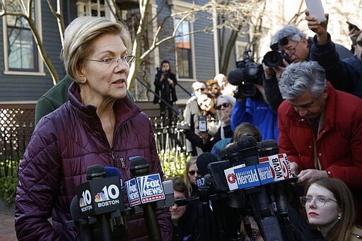 Sen. Elizabeth Warren, D-Mass., speaks to the media outside her home, Thursday, March 5, 2020, in Cambridge, Mass., after she dropped out of the Democratic presidential race. (AP Photo/Steven Senne)