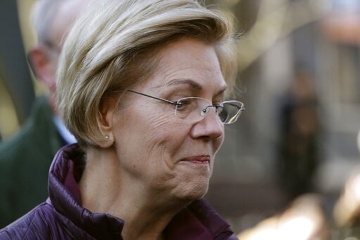 Sen. Elizabeth Warren, D-Mass., speaks to the media outside her home, Thursday, March 5, 2020, in Cambridge, Mass., after she dropped out of the Democratic presidential race. (AP Photo/Steven Senne)