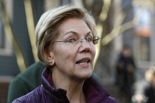 Sen. Elizabeth Warren, D-Mass., speaks to the media outside her home Thursday, March 5, 2020, in Cambridge, Mass., after she dropped out of the Democratic presidential race. (AP Photo/Steven Senne)