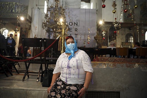 People visit the Church of the Nativity in Bethlehem, West Bank, Thursday, March 5, 2020. Palestinian authorities said the Church of the Nativity in Bethlehem, built atop the spot where Christians believe Jesus was born, will close indefinitely due to coronavirus concerns. (AP Photo/Mahmoud Illean)