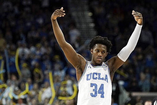 UCLA guard David Singleton celebrates during the second half of an NCAA college basketball game against Arizona in Los Angeles, Saturday, Feb. 29, 2020. UCLA won 69-64. (AP Photo/Chris Carlson)