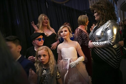 Asher, 12, center, waits backstage to walk down the runway with others during a fashion show held by the Trans Club of New England on Friday, Jan. 31, 2020, in Boston. Asher identifies as non-binary and the preferred pronoun is just &quot;Asher.&quot; Teachers, staff and students in Asher's school have come to understand: Asher is not a boy, not a girl. Asher is non-binary. Asher is Asher. (AP Photo/Wong Maye-E)