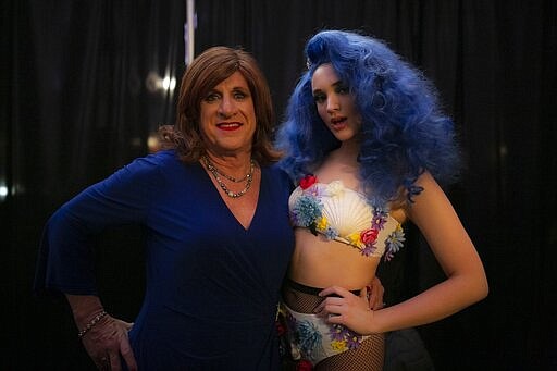 Lisa Smith, 70, left, and Emily Tressa, 18, pose for a photograph as they wait to walk down the runway during a fashion show on Friday, Jan. 31, 2020, in Boston. Smith, who gets to live as a man and as a woman, has been happily married for 44 years. Tressa has lived as a girl since fourth grade; with gender reassignment surgery in June 2019, her transformation became complete. (AP Photo/Wong Maye-E)