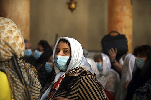 People visit the Church of the Nativity in Bethlehem, West Bank, Thursday, March 5, 2020. Palestinian authorities said the Church of the Nativity in Bethlehem, built atop the spot where Christians believe Jesus was born, will close indefinitely due to coronavirus concerns. (AP Photo/Mahmoud Illean)