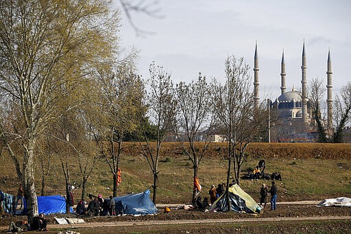 Migrants camp in Edirne near the Turkish-Greek border on Thursday, March 5, 2020. Greece countered accusations from Turkey Wednesday that it was responsible for the death of a migrant, as its border authorities strove for a sixth day to keep thousands of migrants out by using tear gas, stun grenades and water cannons. (AP Photo/Emrah Gurel)