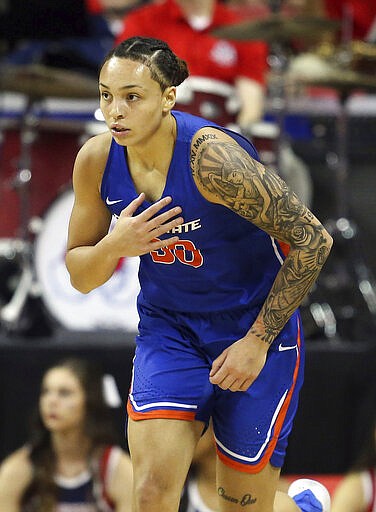 Boise State's Jade Loville reacts after sinking a 3-point shot against Fresno State during the first half of an NCAA college basketball game for the Mountain West Conference women's tournament championship Wednesday, March 4, 2020, in Las Vegas. (AP Photo/Isaac Brekken)