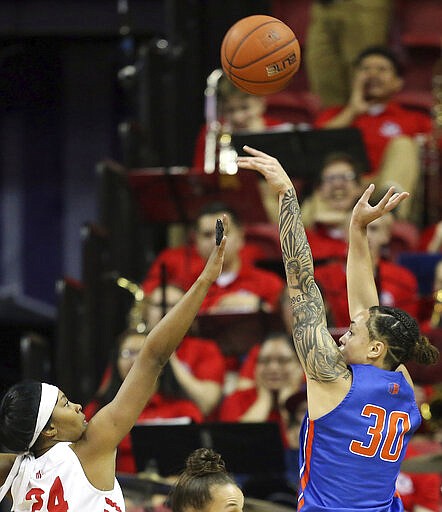 Boise State's Jade Loville (30) shoots as Fresno State's Wytalla Motta (24) defends during the first half of an NCAA college basketball game for the Mountain West Conference women's tournament championship Wednesday, March 4, 2020, in Las Vegas. (AP Photo/Isaac Brekken)
