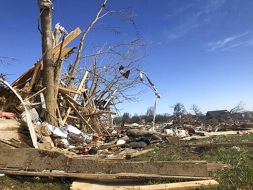 A subdivision near McBroom Chapel Road in Putnam County, Tennessee, was almost completely destroyed by a tornado that blew through on Tuesday morning, March 3, 2020 before dawn. On Wednesday, volunteers cut damaged tress and sorted debris. (AP Photo/Travis Loller)