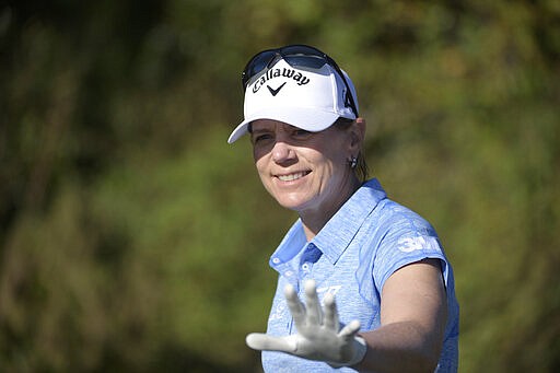 FILE - In this Dec. 7, 2019, file photo, Annika Sorenstam, of Sweden, waves to spectators after teeing off on the first hole during the first round of the Father Son Challenge golf tournament in Orlando, Fla. President Donald Trump is honoring a pair of retired pro golfers with the Presidential Medal of Freedom. The White House says S&ouml;renstam and Gary J. Player will receive the honors during a White House ceremony on March 23. (AP Photo/Phelan M. Ebenhack, File)