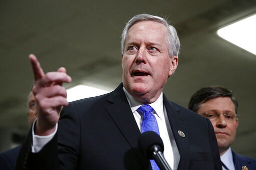 FILE - In this Jan. 29, 2020, file photo, Rep. Mark Meadows, R-N.C., speaks with reporters during the impeachment trial of President Donald Trump on charges of abuse of power and obstruction of Congress on Capitol Hill in Washington. President Donald Trump has named Meadows as his chief of staff, replacing Mick Mulvaney, who had been acting in the role.  (AP Photo/Patrick Semansky, File)