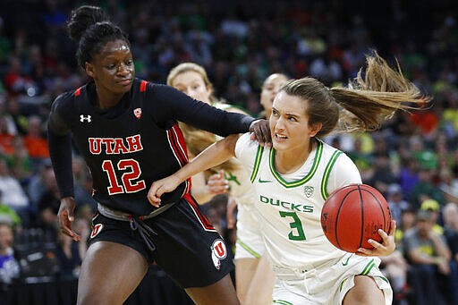 Utah's Lola Pendande (12) fouls Oregon's Taylor Chavez (3) during the second half of an NCAA college basketball game in the quarterfinal round of the Pac-12 women's tournament Friday, March 6, 2020, in Las Vegas. (AP Photo/John Locher)