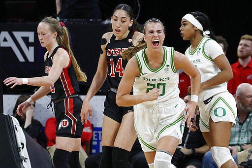 Oregon's Sabrina Ionescu (20) celebrates after a play against Utah during the first half of an NCAA college basketball game in the quarterfinal round of the Pac-12 women's tournament Friday, March 6, 2020, in Las Vegas. (AP Photo/John Locher)